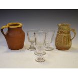 Three glass rummers, one other glass and two pottery jugs Condition: