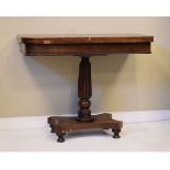 Victorian mahogany rectangular top fold over card table, standing on a turned and reeded pillar