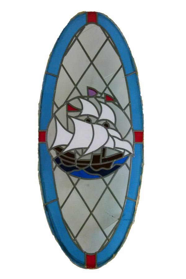 1930's period oval stained and leaded glass panel decorated with a galleon Condition: