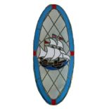 1930's period oval stained and leaded glass panel decorated with a galleon Condition: