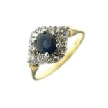Sapphire and diamond cluster ring, the shank stamped 18ct, size L Condition: