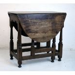 Oak two flap oval gateleg tea table on turned supports Condition: