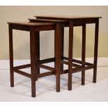 Nest of three teak finish coffee tables Condition: