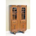 1930's period oak cabinet bookcase fitted three shelves enclosed by a pair of glazed doors, two