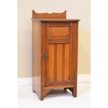 Edwardian walnut pot cupboard having a panelled door Condition: