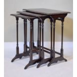 Nest of three mahogany tea tables, each having a carved edge and standing on slender ring turned