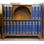 Early 20th Century oak wall mounted or table top book rack containing The Works Of Charles Dickens