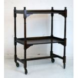 Early 20th Century oak two tier tea trolley on bobbin turned supports Condition: