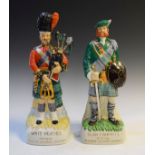 Two White Heather Distillers Ltd advertising figural flasks for White Heather Deluxe and Clan