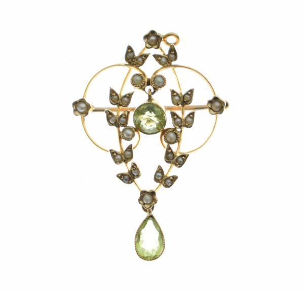 Unmarked Edwardian yellow metal pendant brooch set seed pearls and peridot Condition: