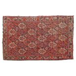20th Century Baktar rug having allover geometric decoration on a red ground within multi borders,