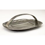 Liberty & Co Tudric pewter oval cake dish, designed by Archibald Knox, having a loop handle and with