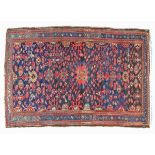 Hamadan rug having geometric and stylised decoration on a blue ground within multi borders, 217cm