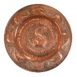 Newlyn School copper charger/circular wall plaque, having Arts & Crafts design embossed decoration