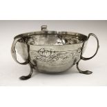 Liberty & Co Tudric pewter bowl decorated with stylised water lilies in relief, triple loop