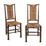 Pair of early 20th Century Arts & Crafts oak side chairs, each having a rush and back and standing