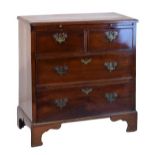 Small George III mahogany chest fitted brushing slide with two short and two long drawers below,