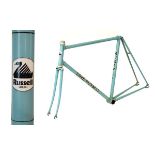 Dave Russell steel racing cycle frame in turquoise with black decals having track/fixed wheel rear