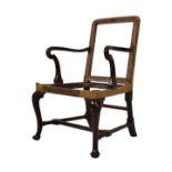 George III mahogany crook arm elbow chair standing on cabriole supports united by stretchers