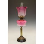 Victorian oil lamp, shaded pink glass reservoir with stylised foliate decoration in relief, reeded