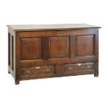 George III oak mule chest having a triple fielded panel front with two conforming drawers below,