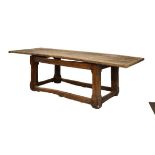 Antique oak refectory dining table, standing on heavy chamfered supports united by stretchers, 249cm