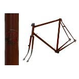 Ferris of Hounslow steel racing cycle frame in light brown with gold decals, having horizontal