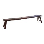 Antique stained pine bench standing on square splayed supports, 226cm long Condition: Please see