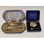 Silver mounted four piece manicure set, cased and a silver mustard and spoon with blue glass