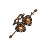 Bar brooch set pair of heart shaped amber coloured faceted stones within seed pearl surround with