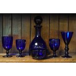 Modern 'Bristol' blue glass decanter, four similar glasses and a finger bowl Condition: