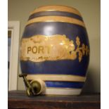 19th Century pottery Port barrel having gilt and blue banded decoration and titled cartouche