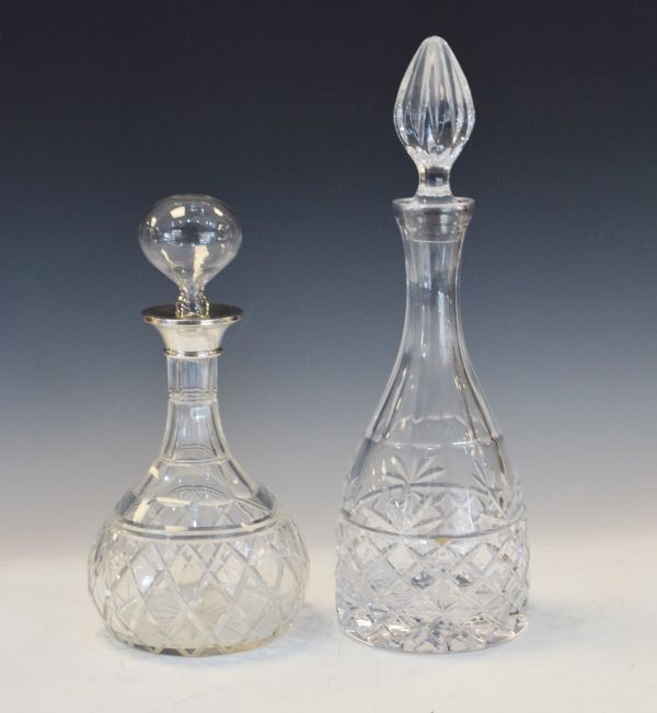 George V cut glass bottle shaped decanter with silver collar and blown glass stopper, London 1924,