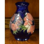 Moorcroft ovoid vase decorated with the Anemone pattern on a blue ground, 19cm high Condition: