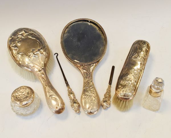 Edwardian silver three piece brush set having Art Nouveau design floral decoration, Birmingham