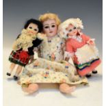 Early 20th Century German bisque head doll having a jointed body, together with two vintage