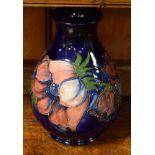 Moorcroft ovoid vase decorated with the Anemone pattern on a blue ground, 21.5cm high Condition: