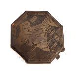 White metal octagonal compact engraved with a map of India inset with ruby coloured stones, the