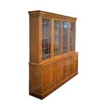 Reproduction yew finish two section bookcase, the upper section fitted four glazed doors, the base