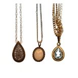 Diamond set tear drop pendant, an opal set pendant and a pear drop pendant set pale blue stone,