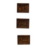 Three Black Forest style carved relief plaques, each decorated with an interior scene Condition: