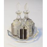French Art Deco black and clear glass five piece condiment set on an octagonal stand Condition: