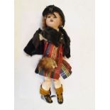 Late 19th/early 20th Century bisque head doll wearing Scottish national dress Condition: