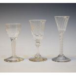 Two antique wine glasses, each having an opaque cotton twist stem, together with another antique