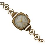 Lady's Zefyr 9ct gold cased cocktail watch on flower link conforming bracelet Condition: