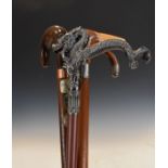 Silver mounted walking stick and three other sticks Condition:
