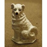 19th Century Staffordshire pottery figure of a seated collie dog decorated with gilt highlights on a