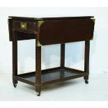 Reproduction Style brass bound mahogany finish two flap two tier tea trolley Condition: