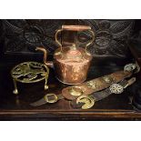 Victorian copper kettle, brass trivet and two martingales Condition: