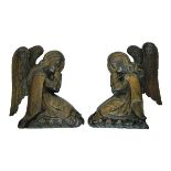 Pair of large carved wooden wall decorations, each depicting a kneeling angel Condition: